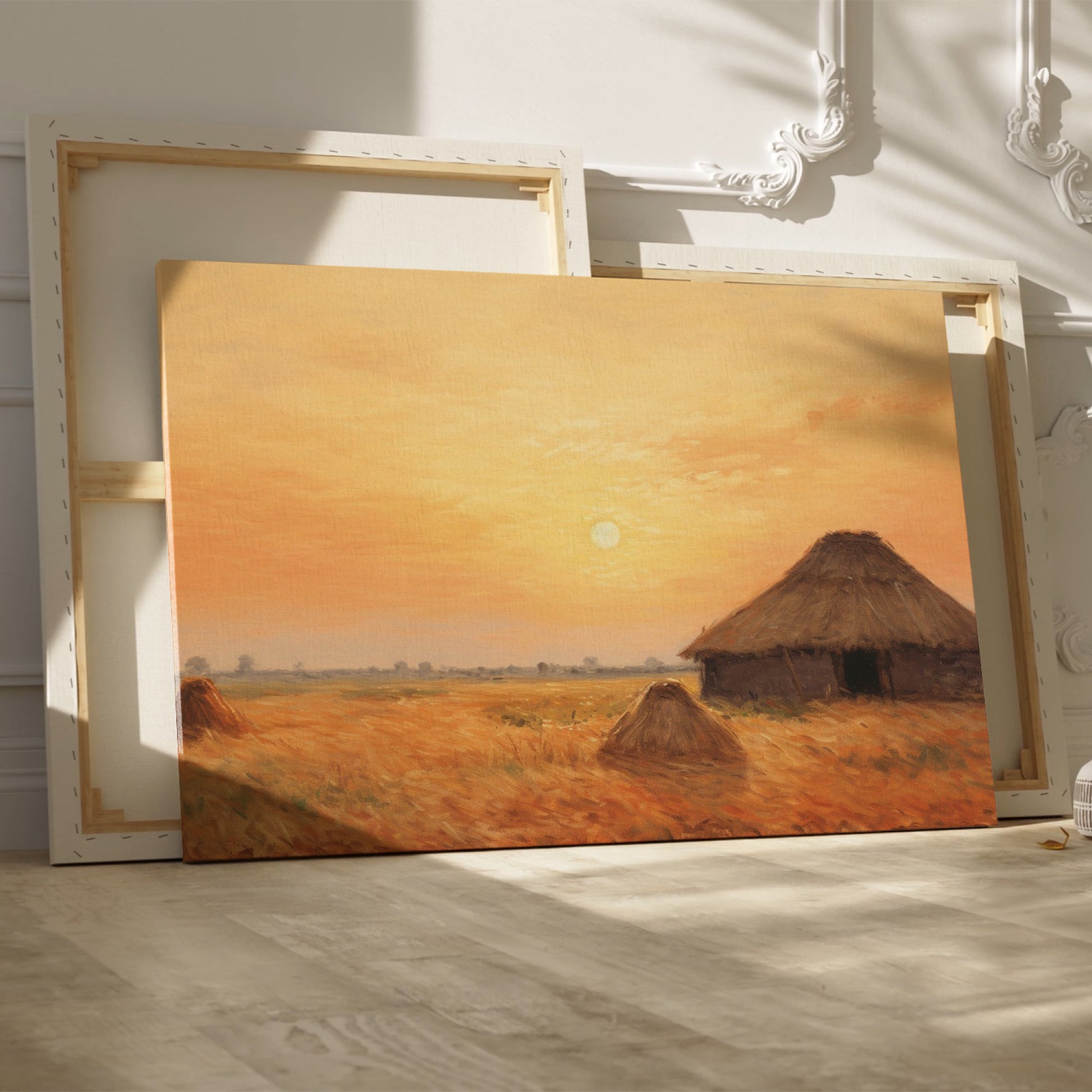 Framed canvas print of a rustic thatched cottage in a countryside landscape at sunset with warm golden and orange hues