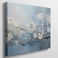 Framed canvas print of elegant white blossoms on a serene blue background with impasto textures