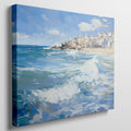 Framed canvas print of a Mediterranean village by the sea with vibrant blue waves and sunny sky