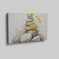 Framed canvas print of Zen stones balanced in watercolour with yellow flowers