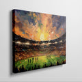 Framed canvas print of an impressionist football stadium with vibrant sunset hues