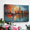 Framed canvas print of an abstract impressionistic sunset marina with a sailing boat and city silhouette