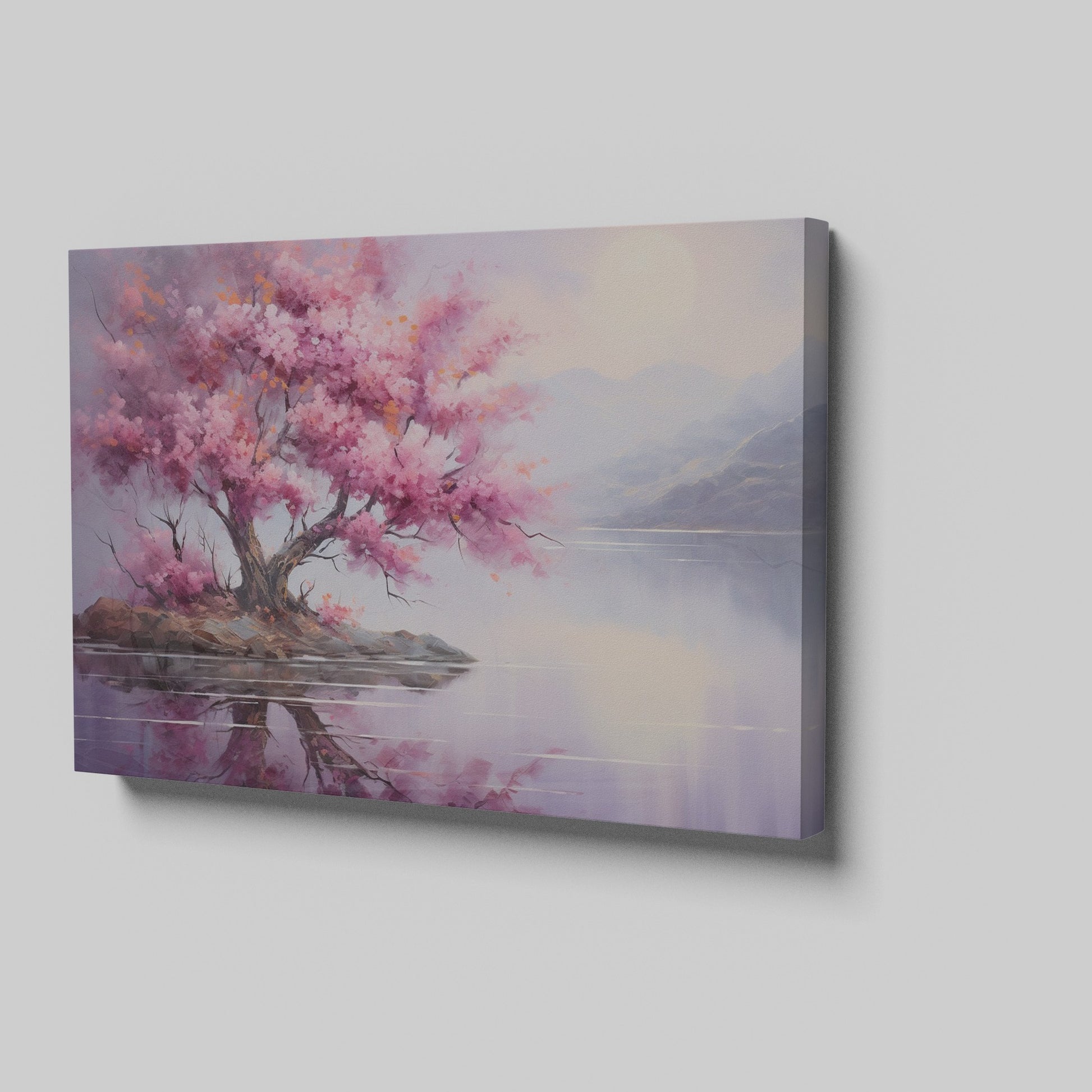 Framed canvas print of a cherry blossom tree by a tranquil lake at dusk with mountains in the background, reflecting soft pink and purple hues