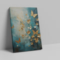 Framed canvas print of abstract painting with butterflies and flowers in gold on a teal background