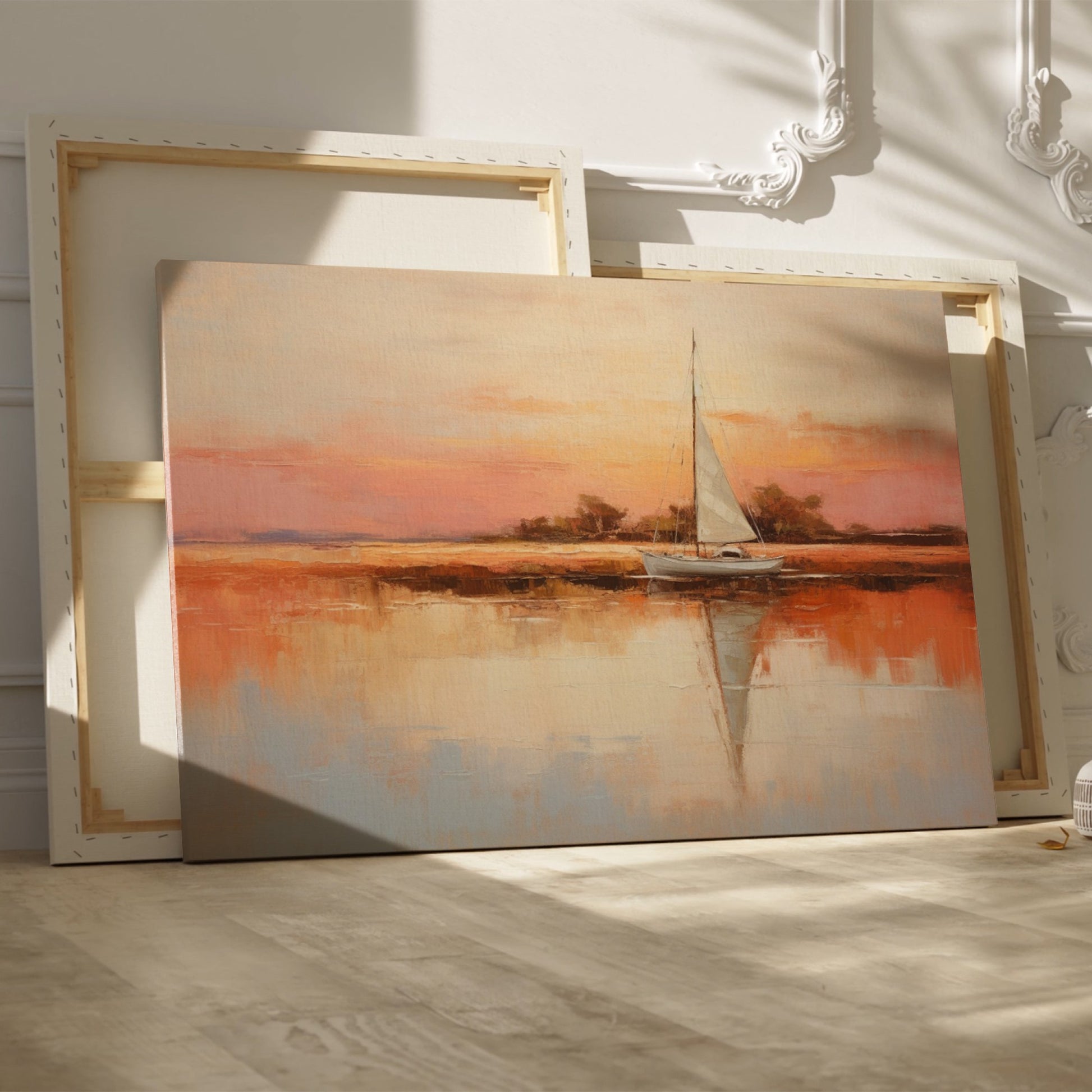 Framed canvas painting of a sailboat at sunset with orange and beige sky reflected in calm blue waters