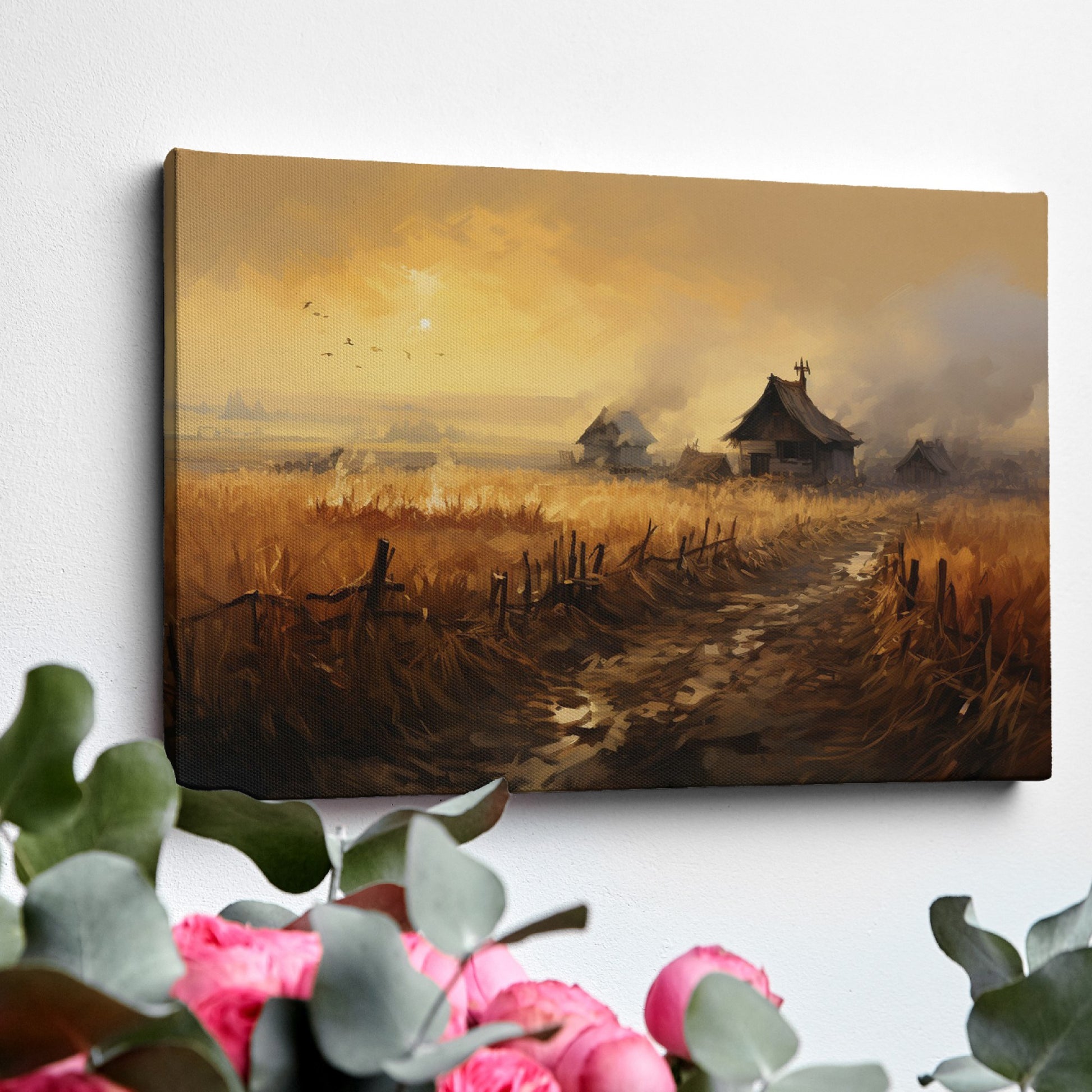 Framed canvas print of a rustic countryside at sunset with golden fields and cottages