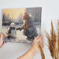 Framed canvas print of a child building a snowman in a snowy urban park during golden hour