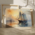 Framed canvas print of an impressionist-style sailing ship at sea during a warm, golden sunset with reflections on the water