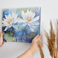 Framed canvas print of tranquil water lilies in watercolour blues and whites