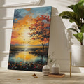 Framed canvas print of a picturesque autumnal sunset with vibrant orange sky and tree reflections on the water