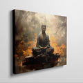 Framed canvas print of a meditative Buddha in a serene forest setting with warm, fiery orange hues