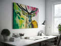 Framed canvas print of a colourful, modern artistic depiction of a stag with vibrant hues.