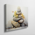 Framed canvas print of Zen rocks stacked with yellow flowers in watercolour