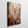 Framed canvas print of a cheerful Pomeranian amidst a vibrant display of autumn leaves