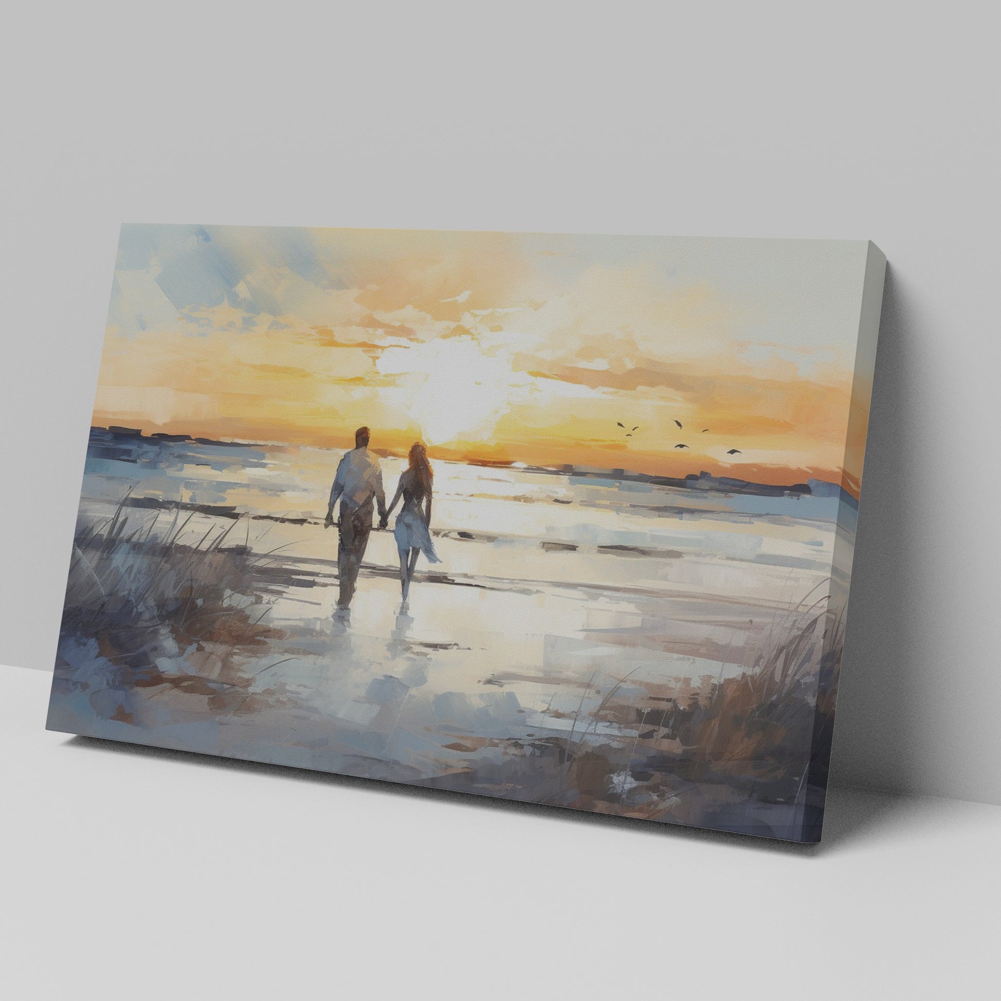 Framed canvas print of a couple walking on the beach at sunset with reflective water and warm colours