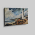 Framed canvas print of a lighthouse by the ocean with dramatic clouds and coastal cliffs