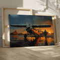 Framed canvas print of a vintage biplane at sunset with pilot walking and the aircraft's reflection on the wet ground