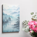 Framed canvas print of a tranquil watercolour landscape with misty blue mountains and serene lake