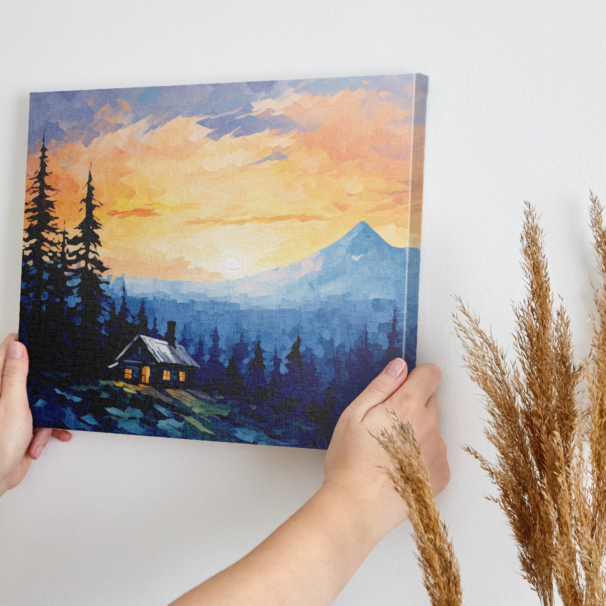 Framed canvas print of a mountain sunrise with a rustic cabin amongst pine trees