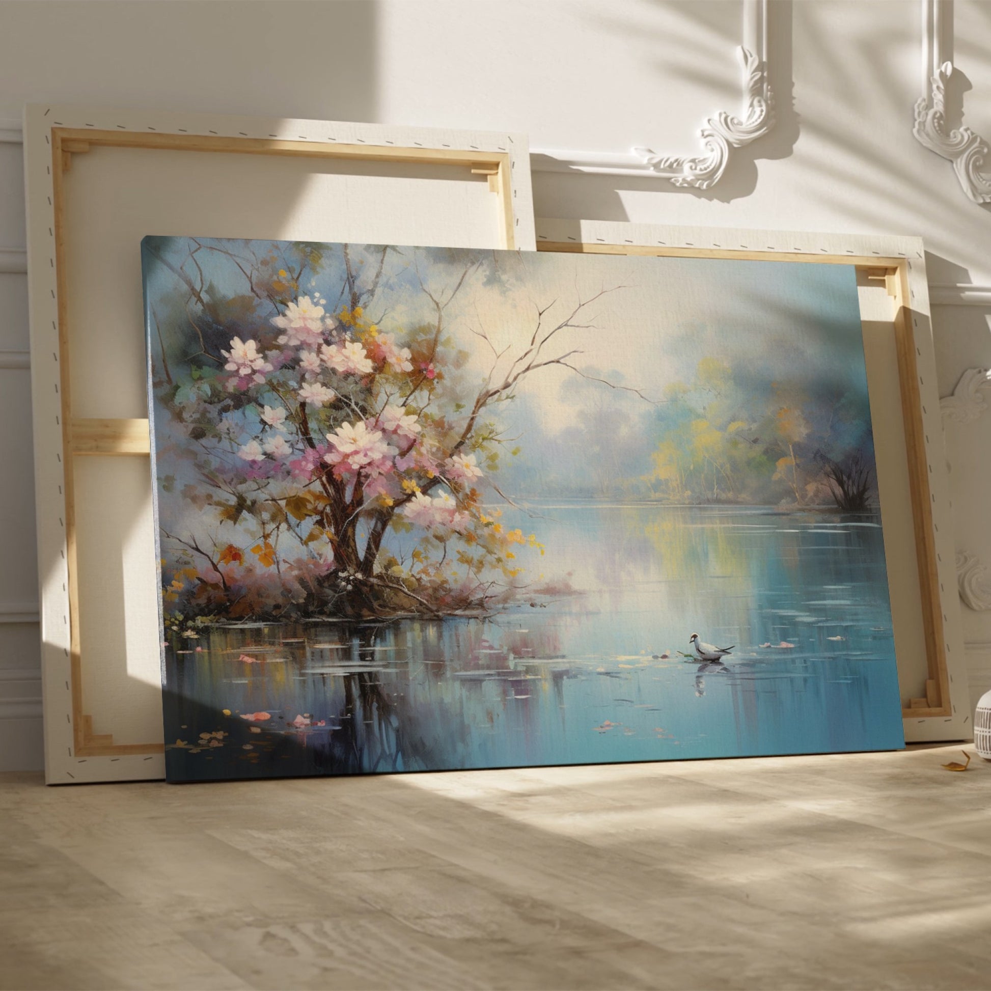 Framed canvas print of impressionist painting with blossoming trees by a serene lake