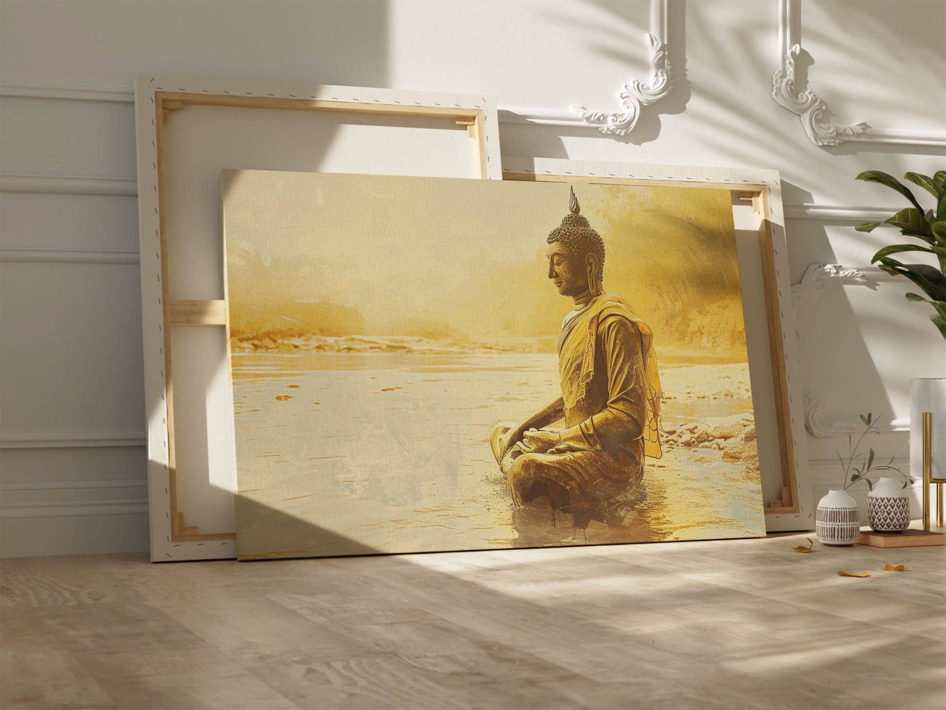 Framed canvas print of a Golden Buddha statue sitting in meditation by the water