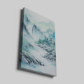 Framed canvas print of a tranquil watercolour painting depicting misty mountains and a serene river landscape in soft blue and green hues.