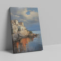 Framed canvas print of a Mediterranean coastal village during sunset with golden reflections on water