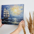 Framed canvas print of a historic sailing ship at sunset with a vibrant seascape