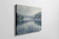 Framed canvas print of a serene lakeside watercolor painting with soft blue and grey tones