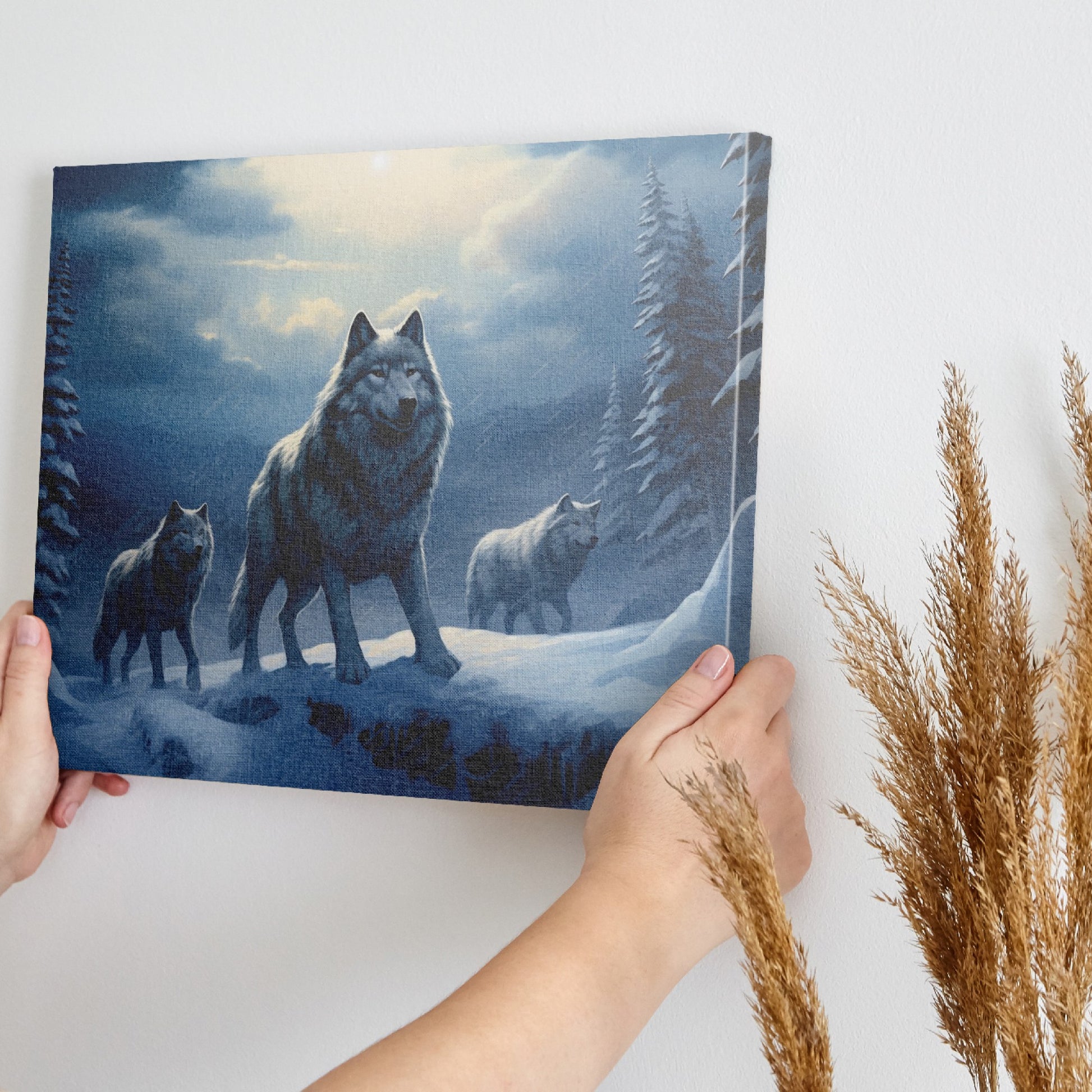 Framed canvas print of a wolf pack under a moonlit sky in a snowy forest