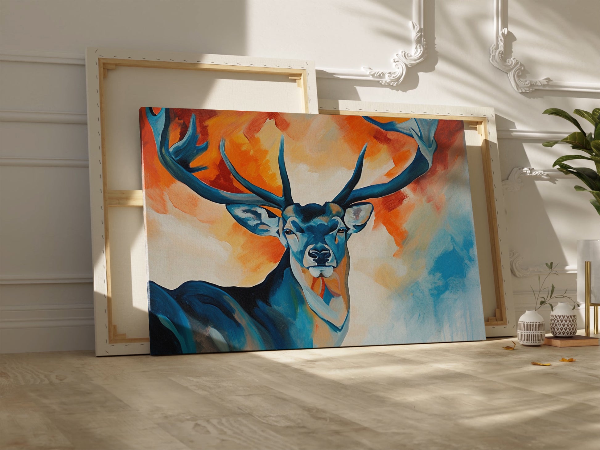 Framed canvas print of a stylized stag with abstract blue and orange background