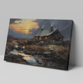 Framed canvas print of a rustic cottage with illuminated windows at sunset, set against a serene countryside landscape with a reflective creek.