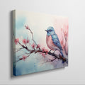 Framed canvas print of a vibrant bluebird on cherry blossom branch in watercolor