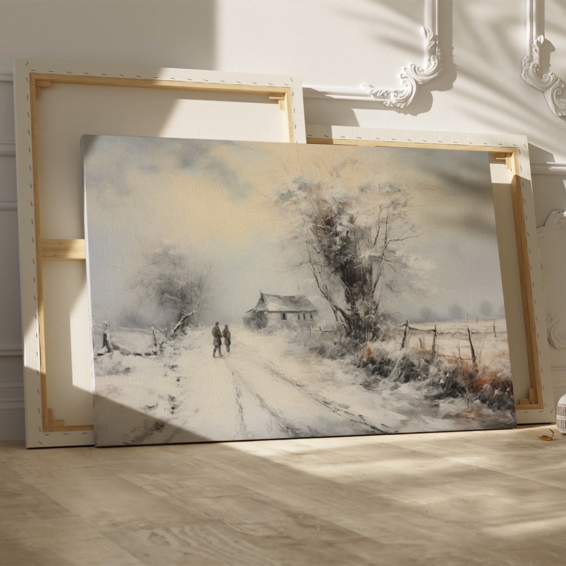 Framed canvas print of a snowy countryside scene with walking figures and a rustic cottage