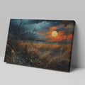 Framed canvas print of a dramatic sunset over a rustic meadow with vivid warm tones