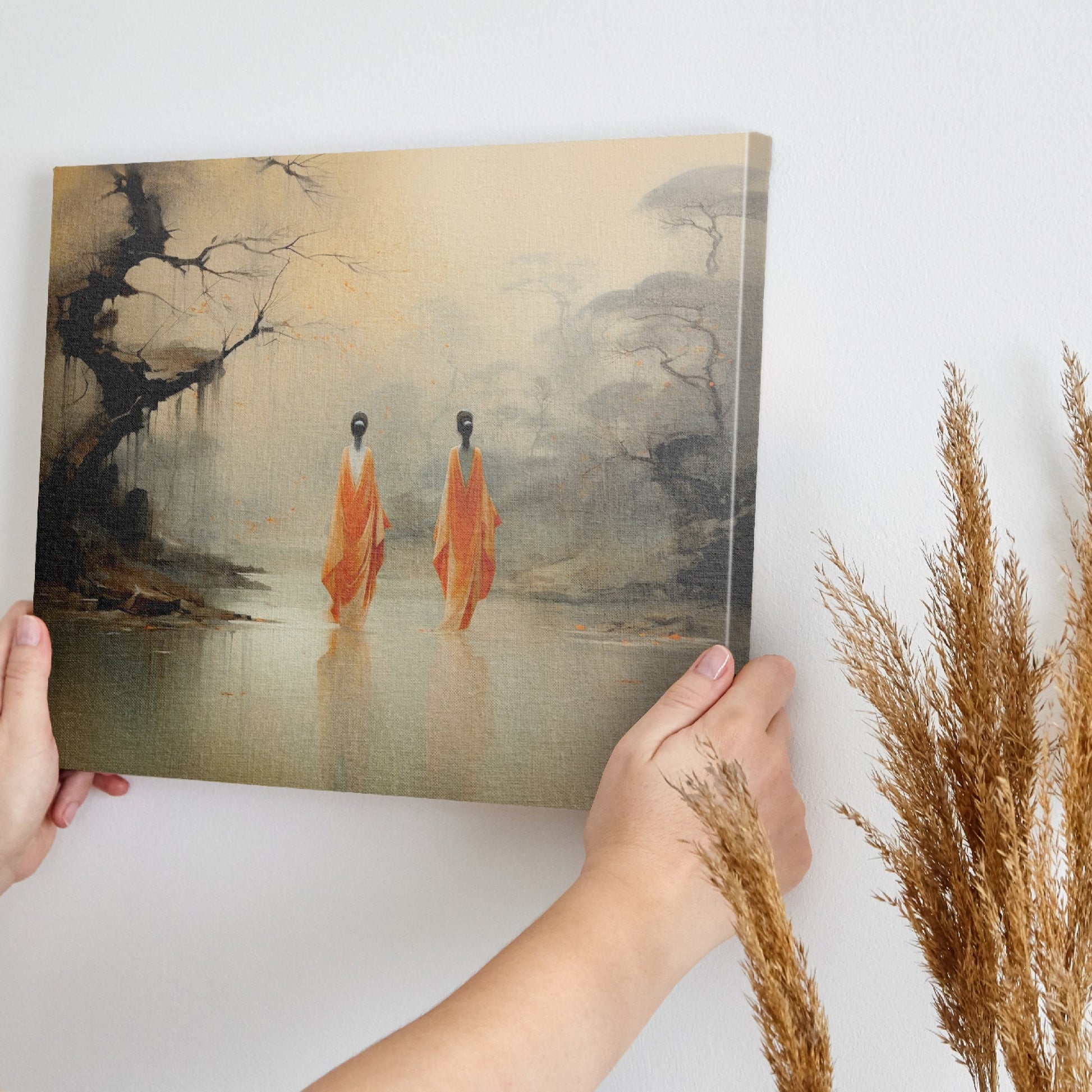 Framed canvas print of monastic figures in saffron robes by a misty river amidst autumn trees