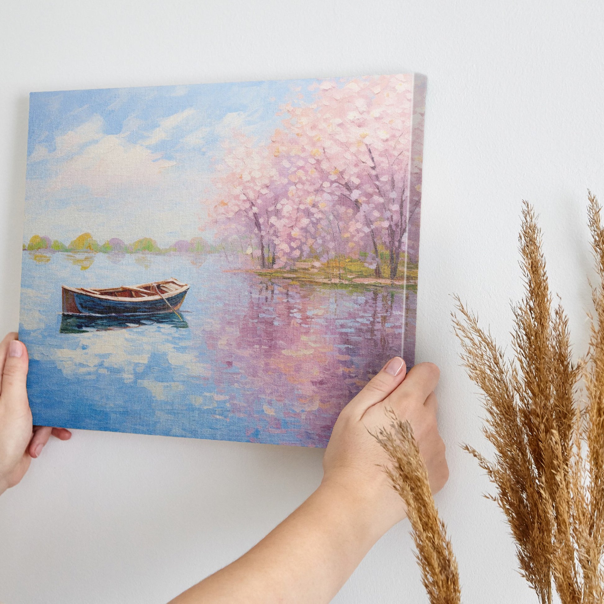 Framed canvas print of an impressionist painting featuring cherry blossoms and a serene lake with a boat