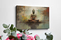 Framed canvas print of a serene Buddha in meditation with an abstract, earth-toned backdrop and reflective water