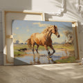 Framed canvas print of a vibrant horse wading in water with sunlit pasture and reflection