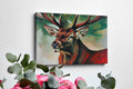 Framed canvas print of an expressive stag portrait with vibrant reds and abstract green background