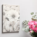 Framed canvas print of monochromatic flowers with intricate designs and neutral tones