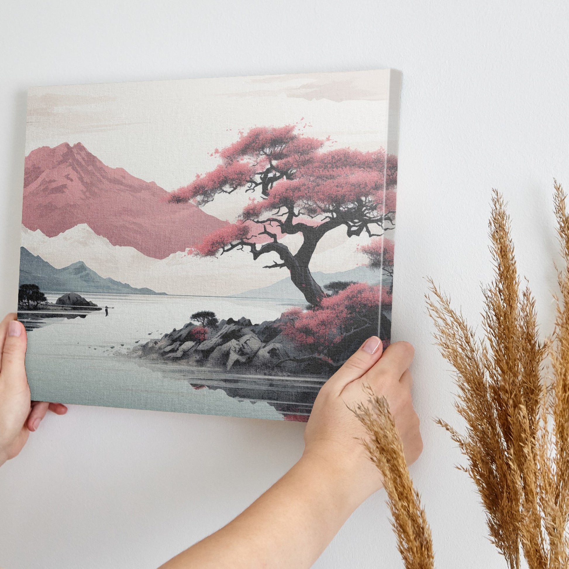 Framed canvas print of a serene mountain landscape with blooming pink sakura trees and tranquil lake