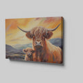 Framed canvas print of Highland cattle with calf at sunset, warm tones and mountain backdrop