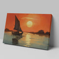 Framed canvas print of a sailboat against an orange sunset with water reflections