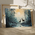 Framed canvas print of a serene forest scene with deer and sunset reflection