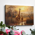 Framed canvas print of a family of giraffes in the savannah during sunset with warm tones