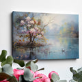 Framed canvas print of impressionist painting with blossoming trees by a serene lake