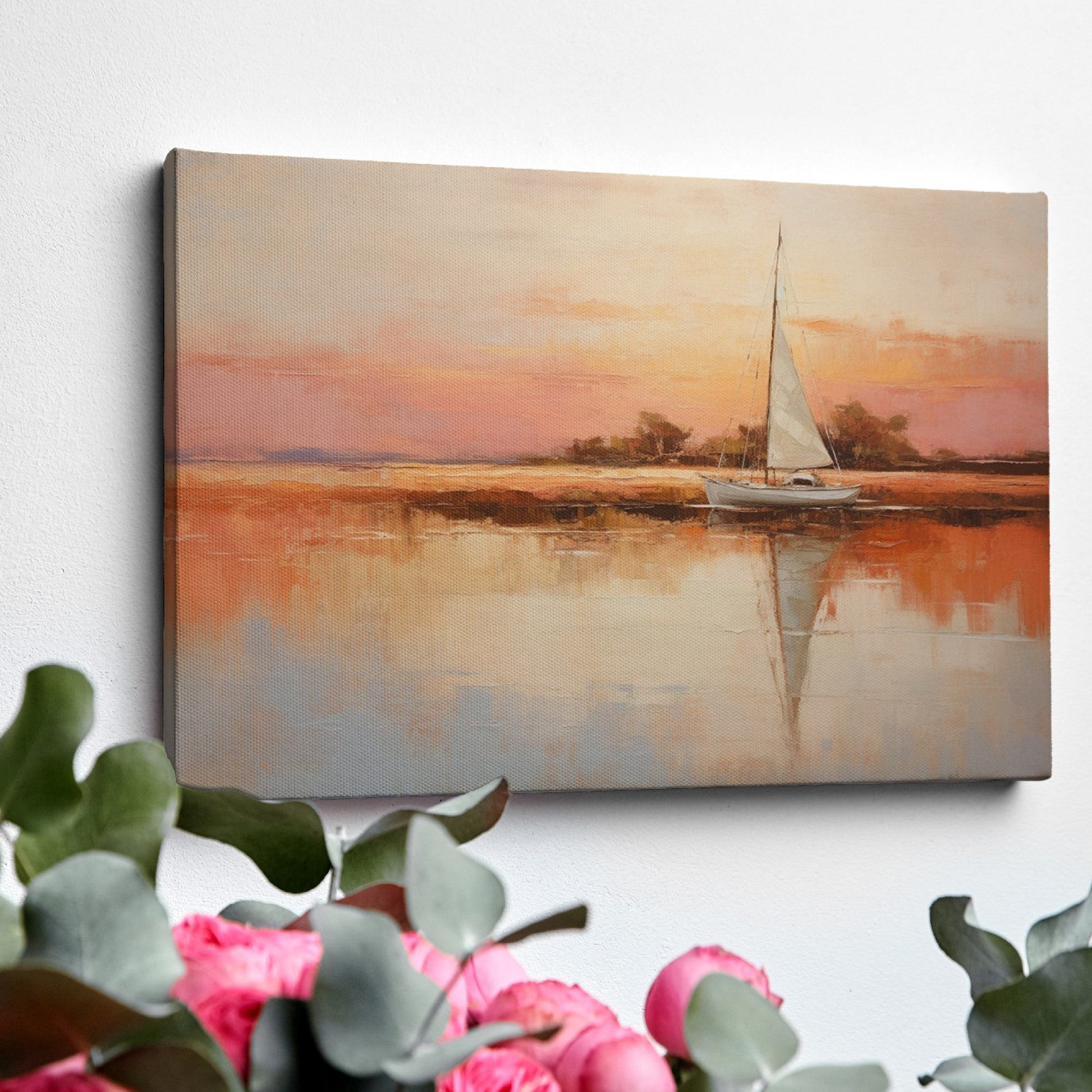 Framed canvas painting of a sailboat at sunset with orange and beige sky reflected in calm blue waters