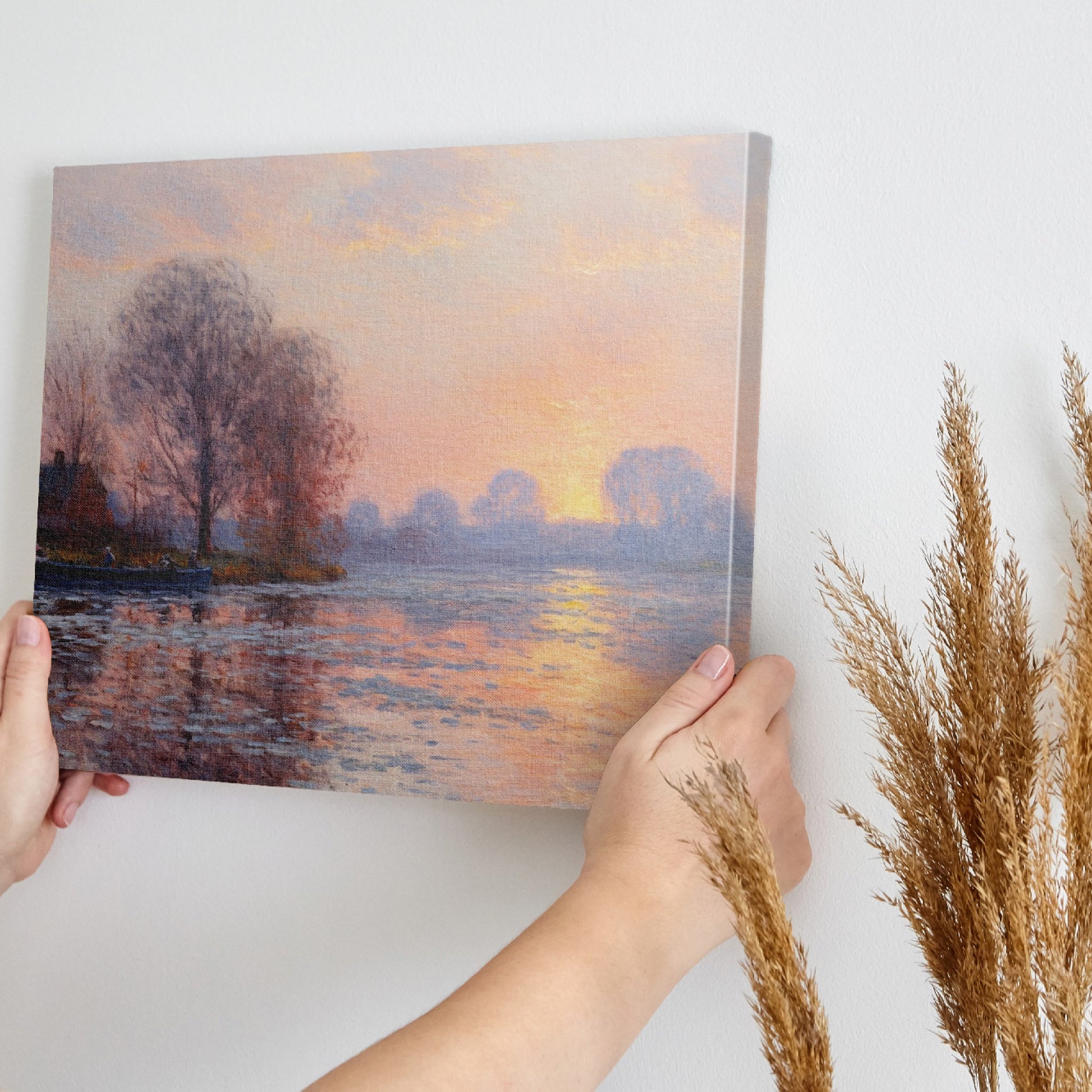 Framed canvas print of an Impressionist-style landscape with a sunset reflecting on a river