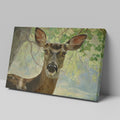 Framed canvas print of a detailed and serene deer portrait with a woodland backdrop in natural tones